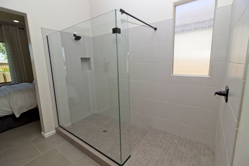 Open Concept Walk-In Shower with Black Accents